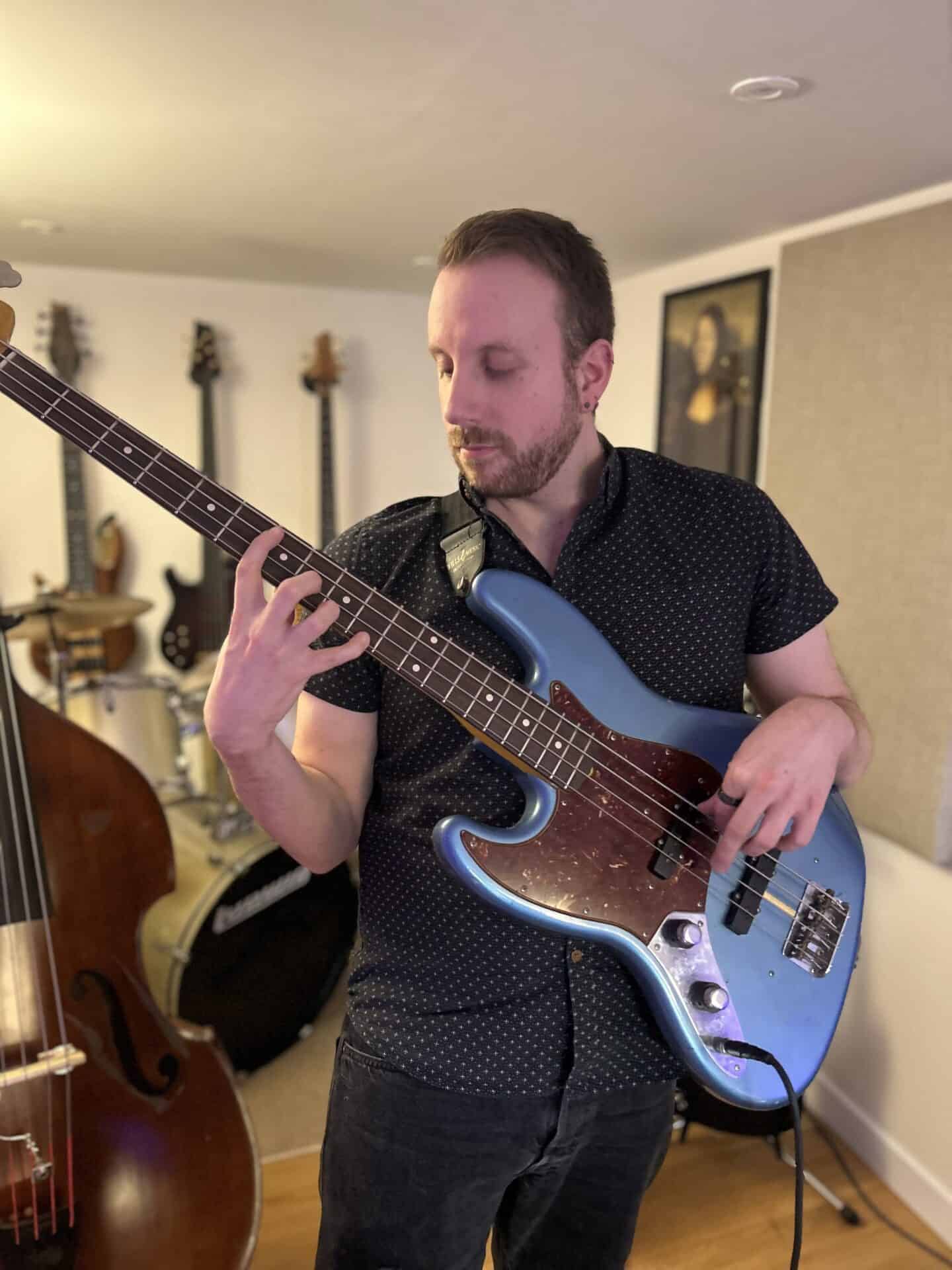 The Slap'n'Pop Music studio in Sheffield with bass, guitar, drums, and recording equipment